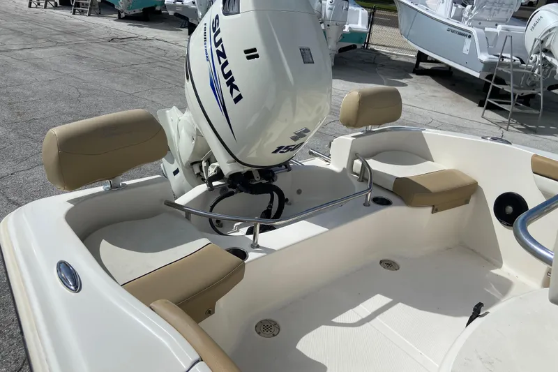 Slide: The Image of 2016 Pioneer 197 Sportfish boat with Suzuki outboard motor, beige seating. - 14