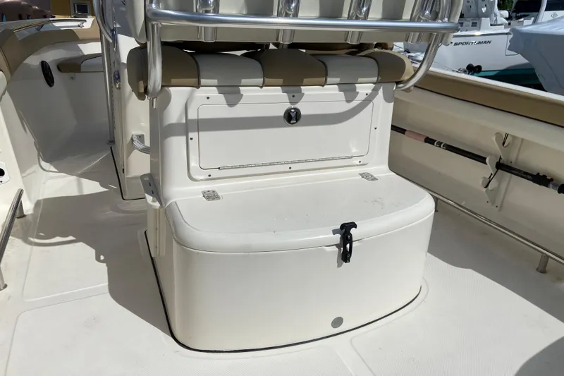 Slide: The Image of 2016 Pioneer 197 Sportfish boat interior with seating and storage compartment. - 16