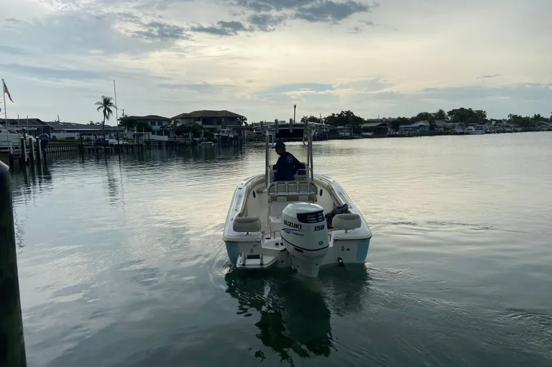 Slide: The Image of 2016 Pioneer 197 Sportfish boat on calm water at sunset. - 4