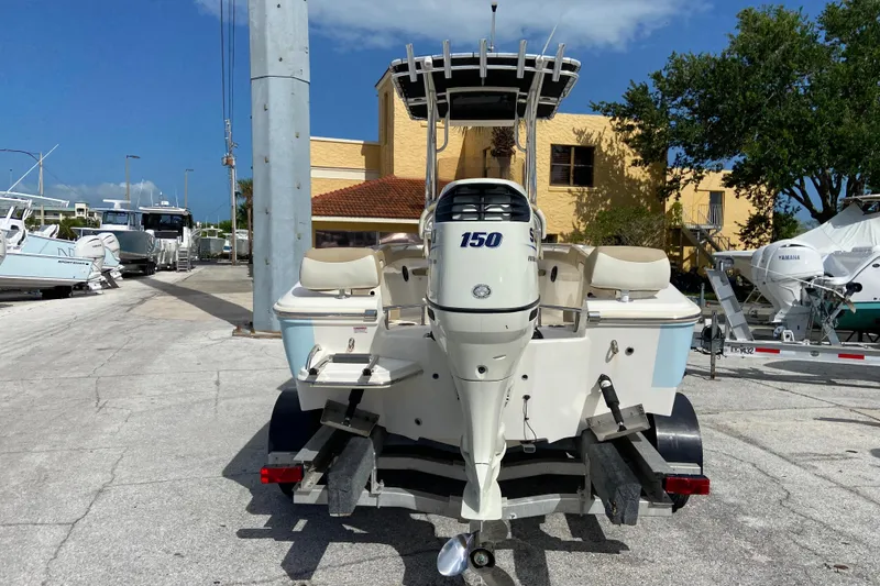 Slide: The Image of 2016 Pioneer 197 Sportfish boat with 150 horsepower engine, parked outdoors. - 11