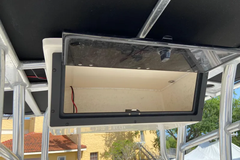 Slide: The Image of Open storage compartment on a 2016 Pioneer 197 Sportfish boat, featuring metal framework. - 25