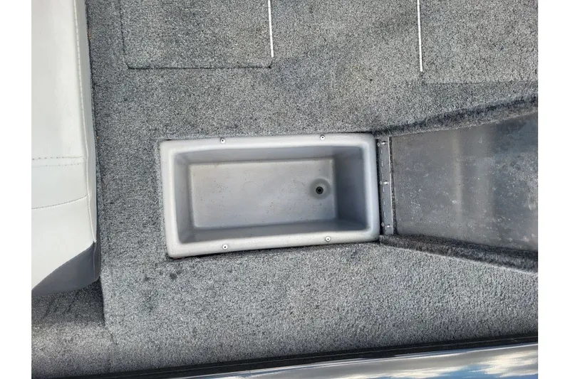 Slide: The Image of 2018 Tracker Pro Team 190 TX boat interior with storage compartment. - 5