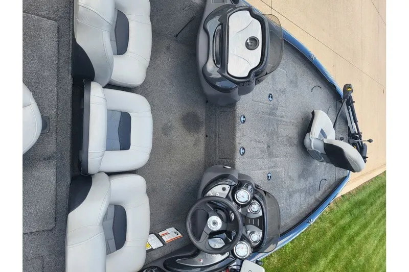 Slide: The Image of 2018 Tracker Pro Team 190 TX boat interior with seating and control panel. - 6