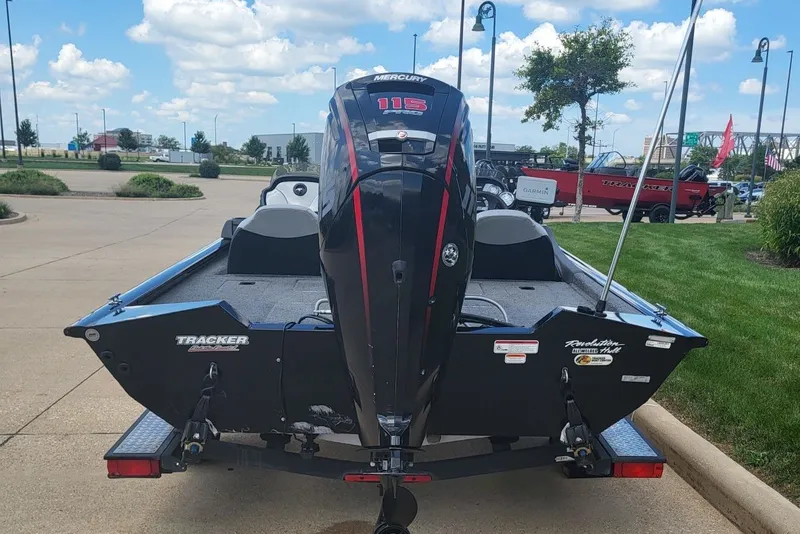 Slide: The Image of 2018 Tracker Pro Team 190 TX boat with Mercury 115 engine, parked outdoors. - 4