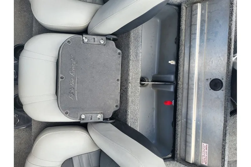 Slide: The Image of 2018 Tracker Pro Team 190 TX boat interior with seating and storage compartment. - 7