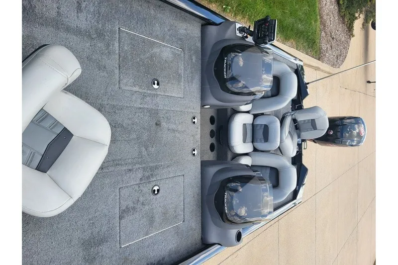 Slide: The Image of 2018 Tracker Pro Team 190 TX boat interior with seating and control panel. - 12