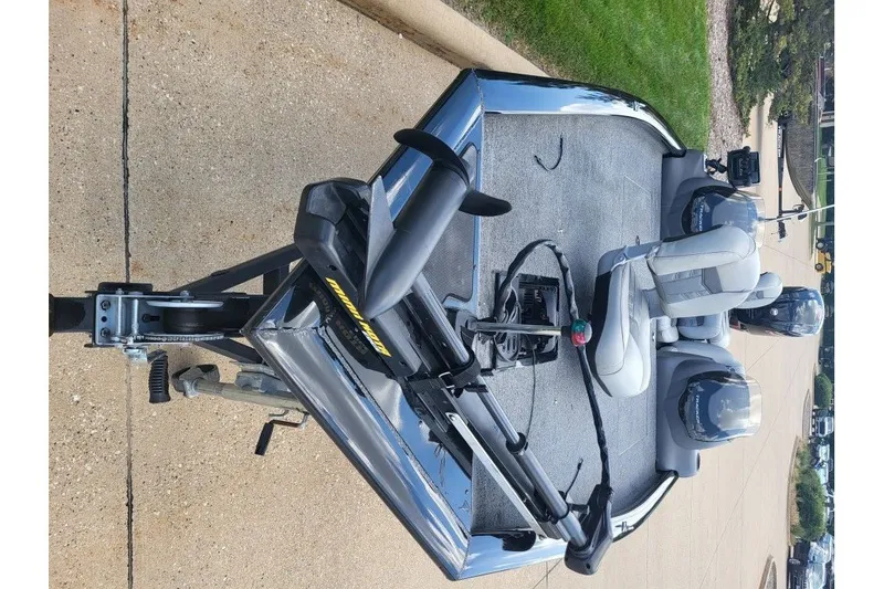 Slide: The Image of 2018 Tracker Pro Team 190 TX fishing boat on trailer, featuring dual seats and trolling motor. - 9