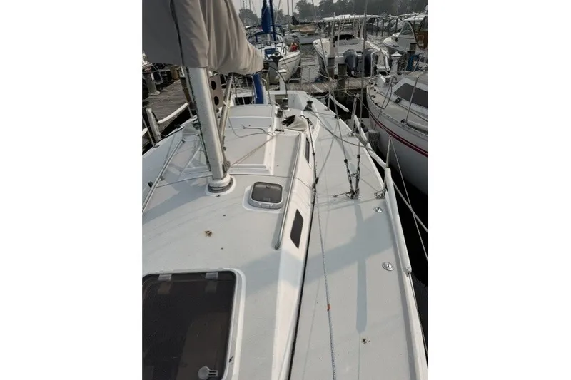 Slide: The Image of 2001 J Boats J/105 sailboat docked, showcasing deck and rigging details. - 8