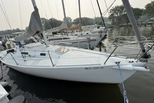 Slide: The Image of 2001 J Boats J/105 sailboat docked in a marina, side view. - 6