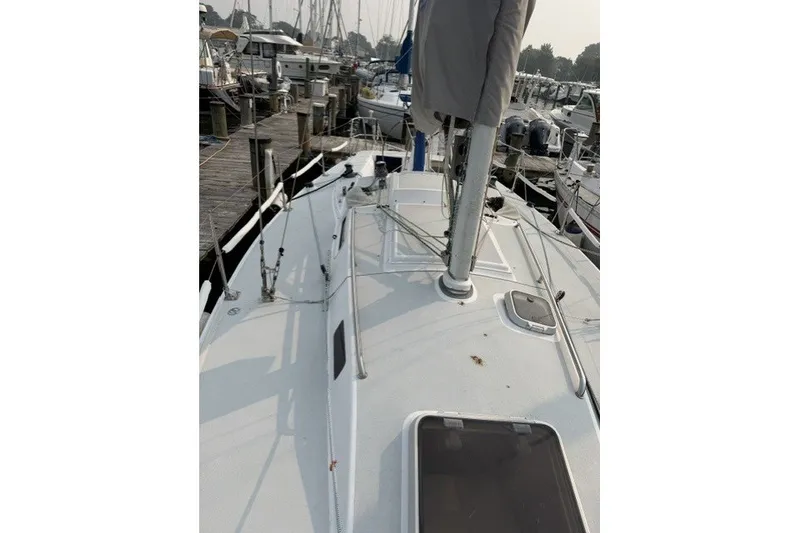 Slide: The Image of 2001 J Boats J/105 sailboat docked at marina, view of deck and mast. - 7