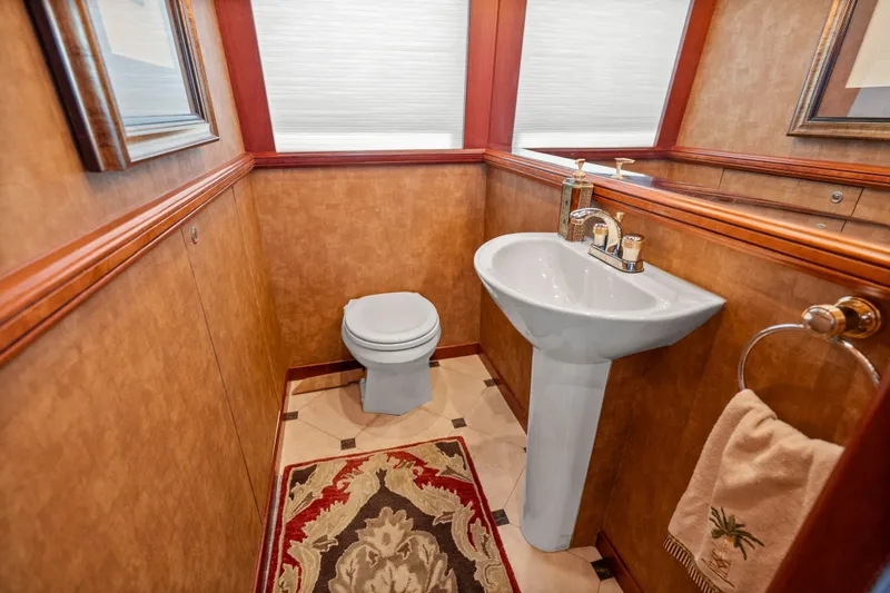 Slide: The Image of Luxurious 2004 Cheoy Lee Flybridge yacht bathroom with elegant fixtures and decorative accents. - 25