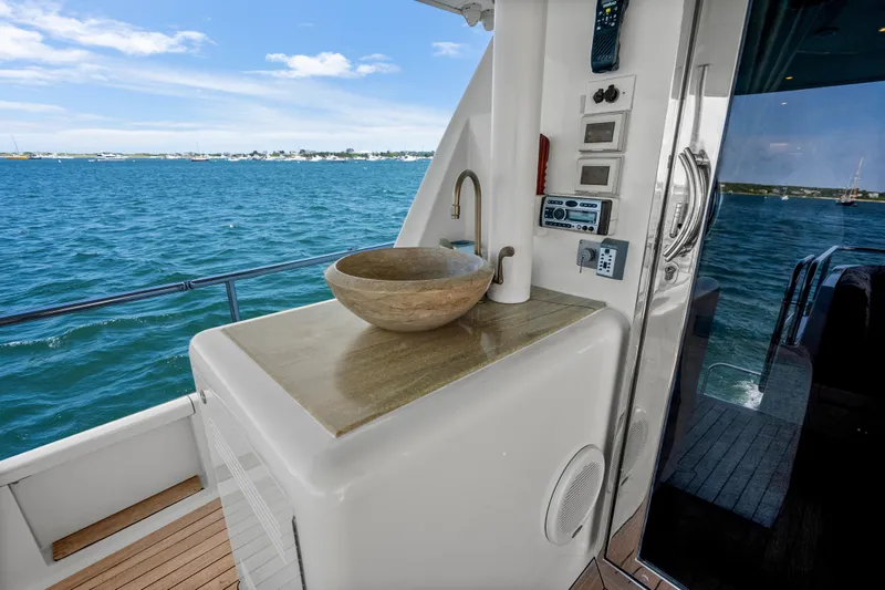 Slide: The Image of 2004 Cheoy Lee Flybridge yacht with outdoor sink and ocean view. - 9