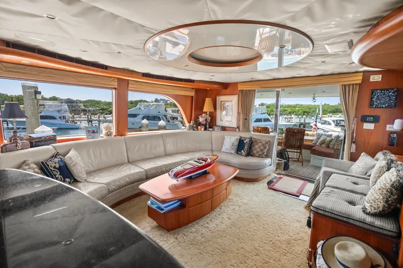 Slide: The Image of Luxurious 2004 Cheoy Lee Flybridge yacht interior with elegant seating and marina view. - 21