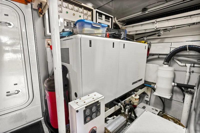 Slide: The Image of Engine room of 2004 Cheoy Lee Flybridge yacht with generator and control panels. - 44
