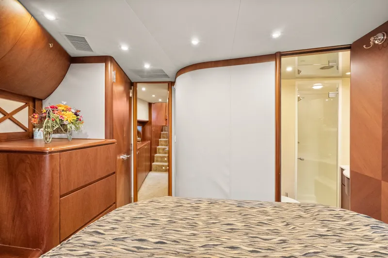 Slide: The Image of Luxurious 2004 Cheoy Lee Flybridge yacht interior with elegant wood finishes and modern amenities. - 36