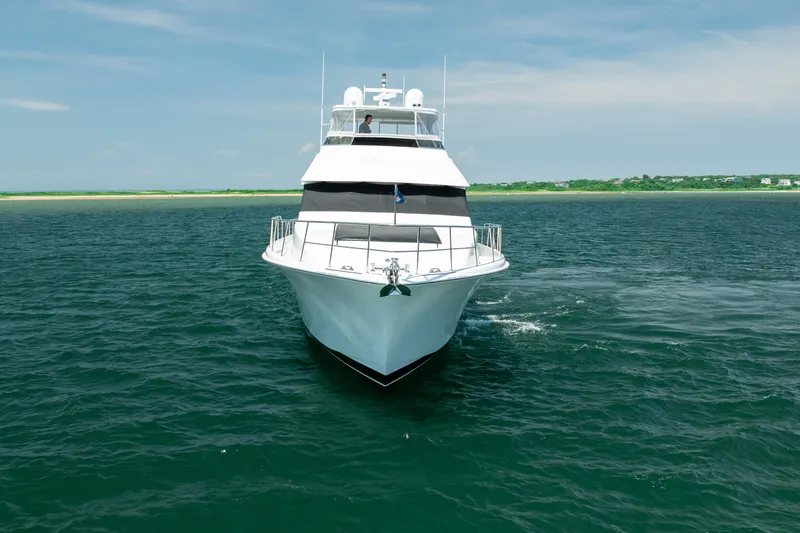 Slide: The Image of 2004 Cheoy Lee Flybridge yacht cruising on open water under clear skies. - 3