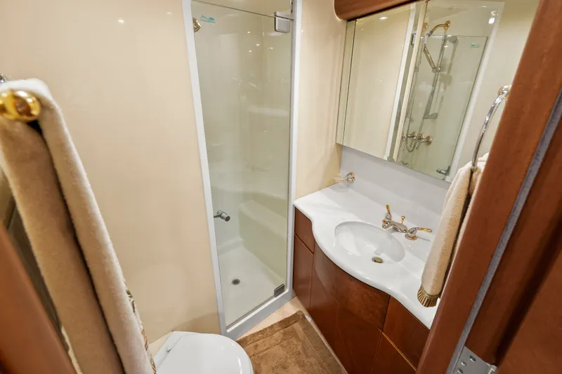 Slide: The Image of Luxurious 2004 Cheoy Lee Flybridge yacht bathroom with shower, sink, and elegant fixtures. - 37