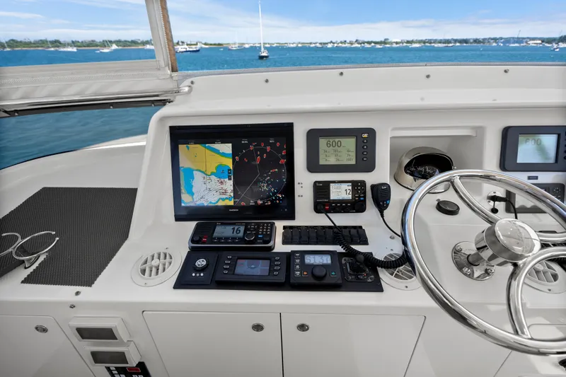 Slide: The Image of Helm of 2004 Cheoy Lee Flybridge yacht with navigation equipment and ocean view. - 18