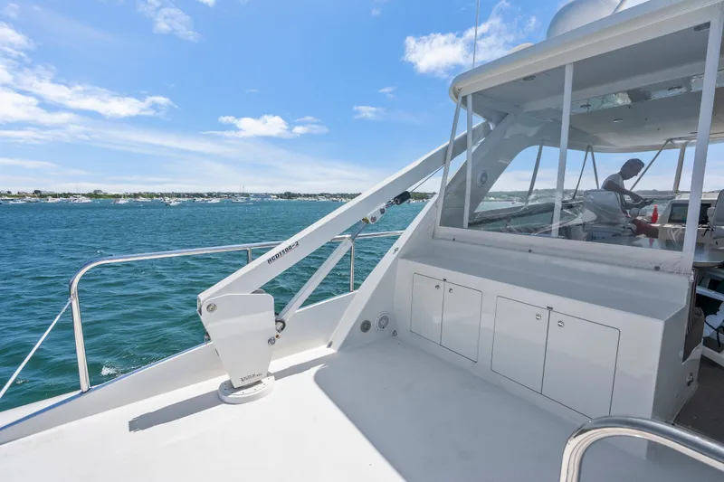 Slide: The Image of 2004 Cheoy Lee Flybridge yacht on open water, featuring spacious deck and modern design. - 13