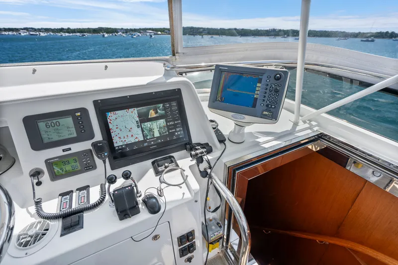 Slide: The Image of 2004 Cheoy Lee Flybridge helm with navigation equipment and ocean view. - 19