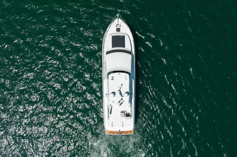 Slide: The Image of Aerial view of 2004 Cheoy Lee Flybridge yacht cruising on open water. - 7
