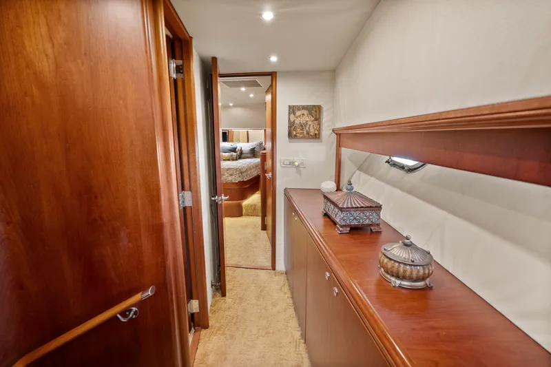 Slide: The Image of Luxurious interior hallway of 2004 Cheoy Lee Flybridge yacht with elegant wood finishes. - 30