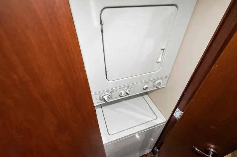 Slide: The Image of Stacked washer and dryer in 2004 Cheoy Lee Flybridge yacht interior. - 31
