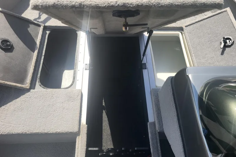 Slide: The Image of 2014 G3 Angler V172 FS boat interior with open storage compartments. - 7