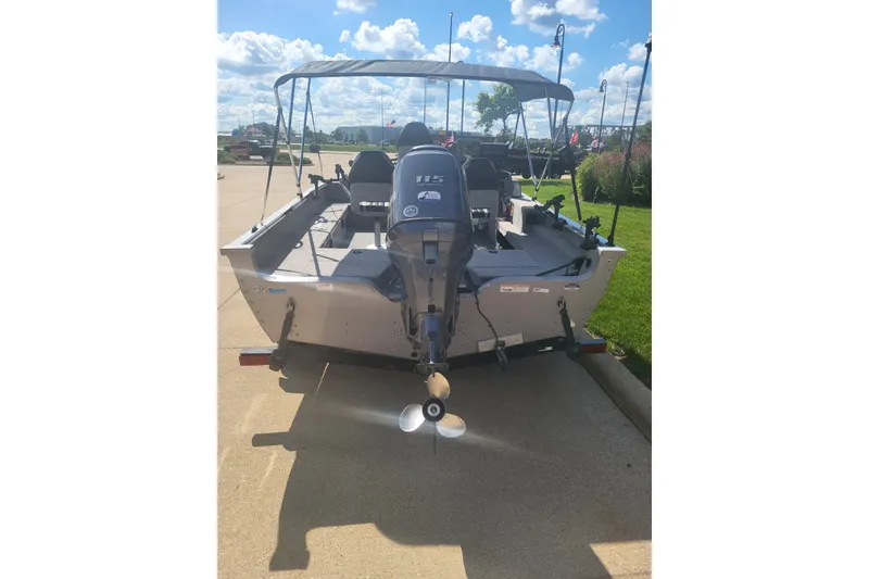 Slide: The Image of 2014 G3 Angler V172 FS boat with outboard motor on a sunny day. - 2