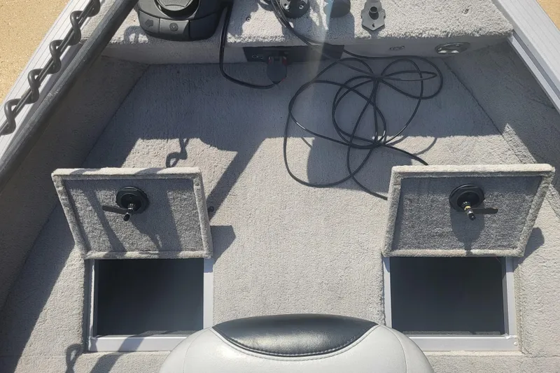 Slide: The Image of The image shows the bow of a 2014 G3 Angler V172 FS boat with two open storage compartments. - 8