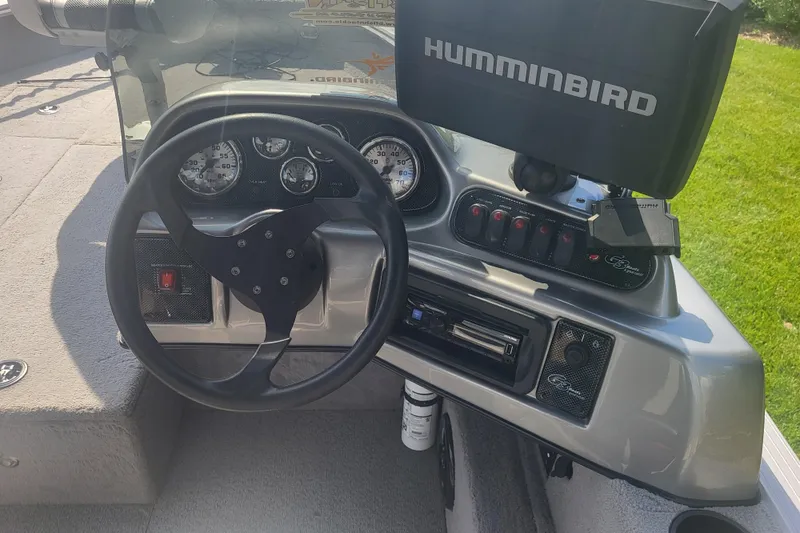 Slide: The Image of 2014 G3 Angler V172 FS boat dashboard with steering wheel and Humminbird fish finder. - 5