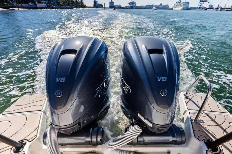 Slide: The Image of Twin V8 outboard engines on Zodiac X10CC boat, 2025 model, cruising in a harbor. - 24