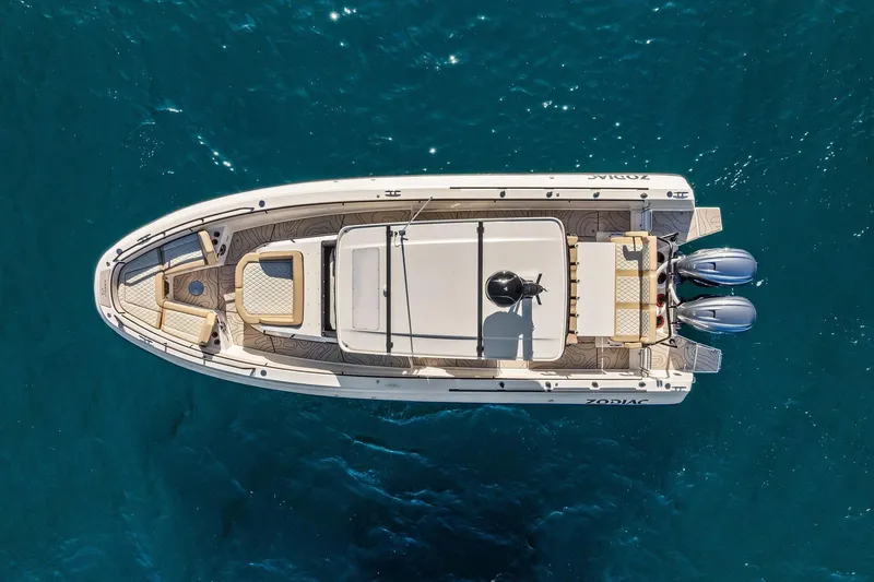 Slide: The Image of Overhead view of 2025 Zodiac X10CC boat on clear blue water. - 20