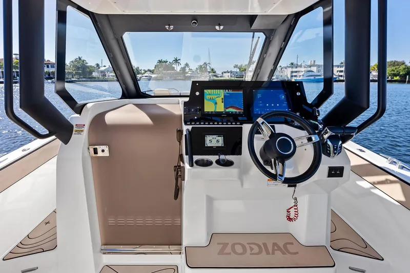 Slide: The Image of Interior view of 2025 Zodiac X10CC boat cockpit with modern navigation system. - 35