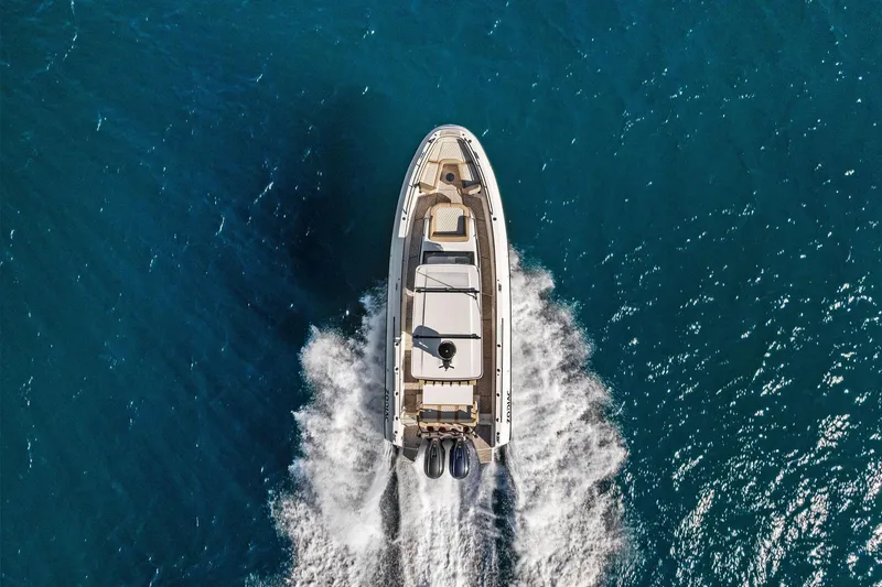Slide: The Image of Aerial view of 2025 Zodiac X10CC boat cruising on blue ocean waters. - 8