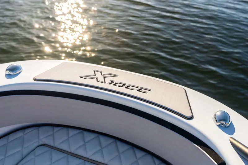 Slide: The Image of 2025 Zodiac X10CC boat detail with sunlit water background. - 49