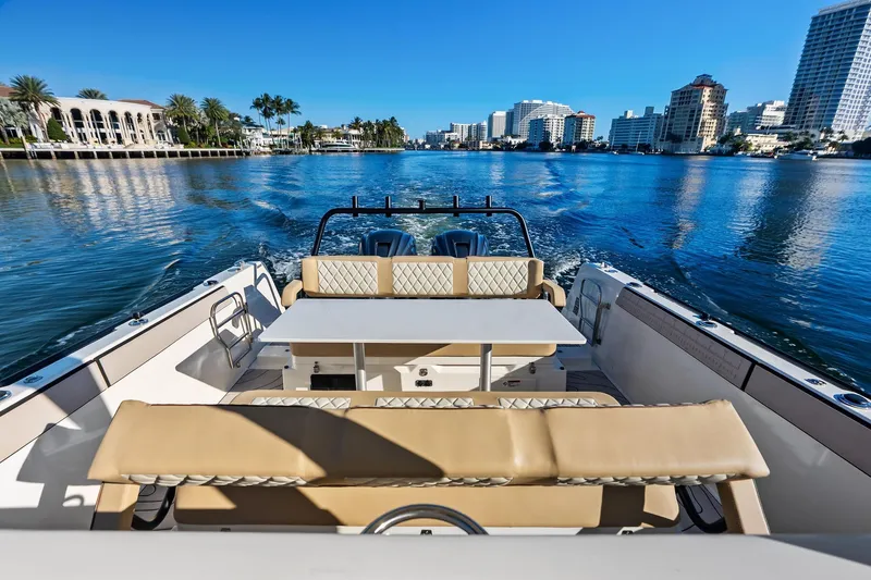 Slide: The Image of Luxury Zodiac X10CC boat cruising on a sunny day, showcasing elegant seating and waterfront views. - 27