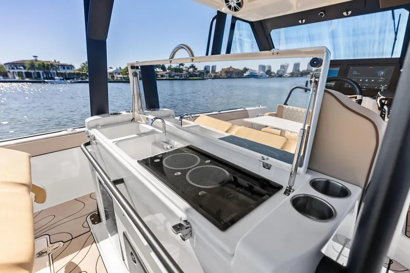 Slide: The Image of Luxury Zodiac X10CC 2025 boat interior with modern kitchen and scenic waterfront view. - 33