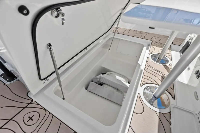 Slide: The Image of Open storage compartment on 2025 Zodiac X10CC boat with modern design details. - 52