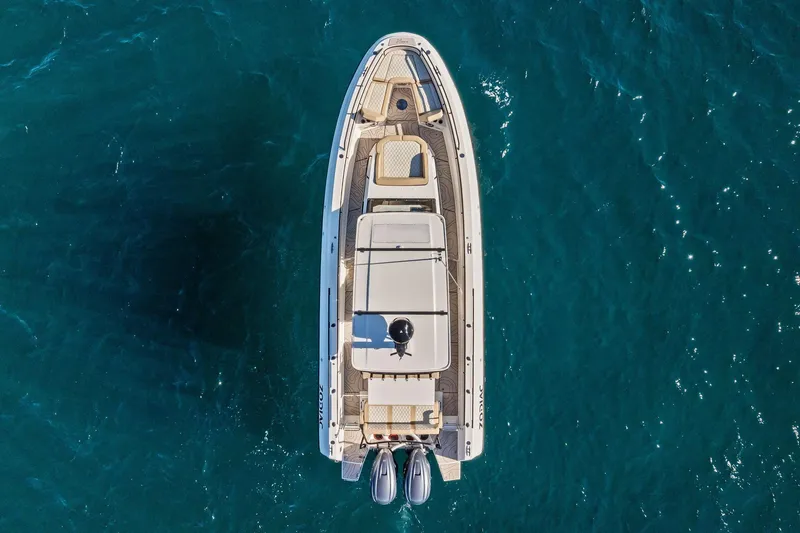 Slide: The Image of Overhead view of 2025 Zodiac X10CC boat on clear blue water. - 21