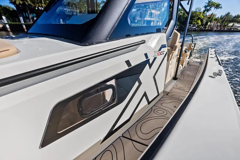 Slide: The Image of 2025 Zodiac X10CC boat with sleek design and modern detailing on the water. - 39