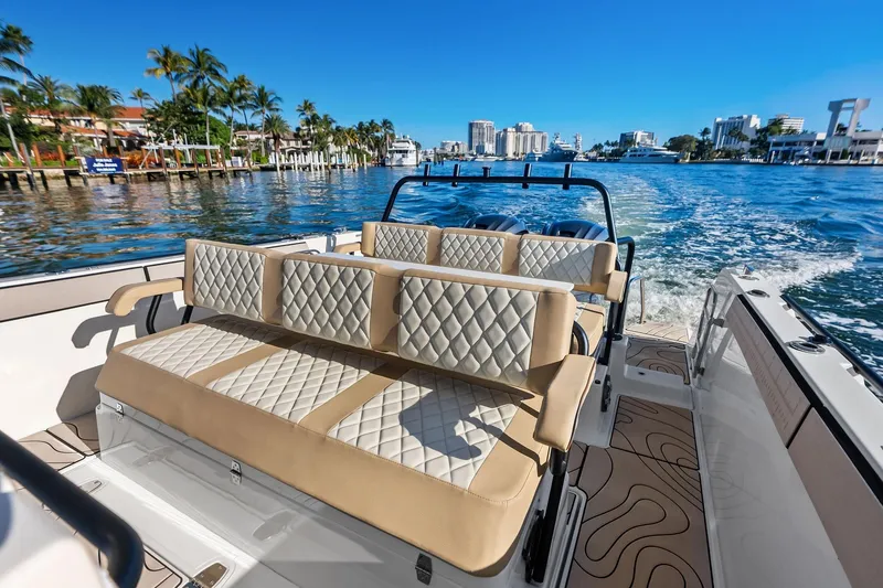 Slide: The Image of 2025 Zodiac X10CC boat with luxurious seating cruising on a sunny waterfront. - 30
