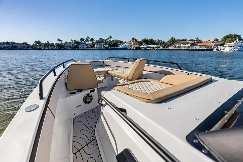 Slide: The Image of 2025 Zodiac X10CC boat with luxurious seating on a calm waterfront. - 40