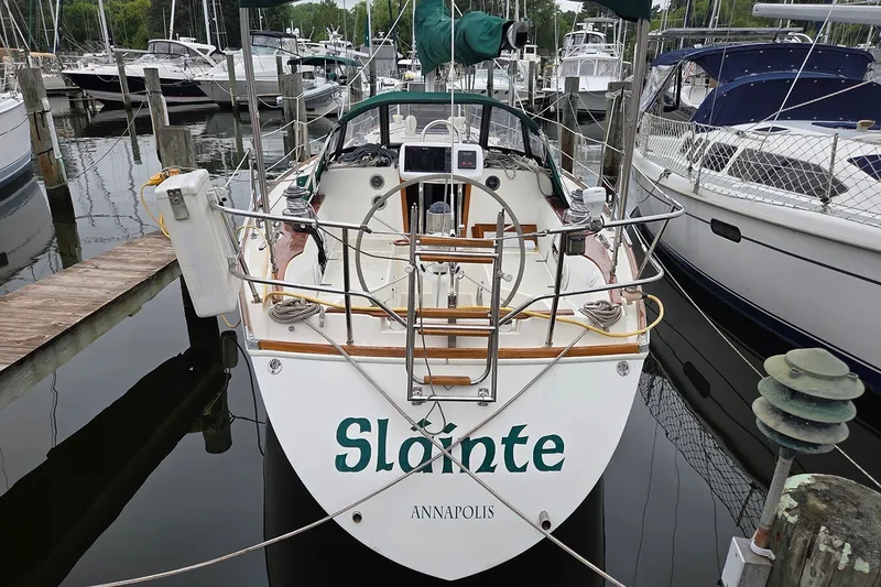 Slide: The Image of 1983 Sabre 38 sailboat named "Slainte" docked in Annapolis marina. - 0