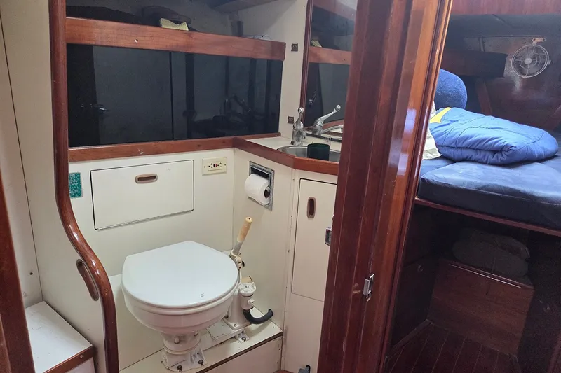 Slide: The Image of Interior of 1983 Sabre 38 sailboat showing bathroom and sleeping area. - 26