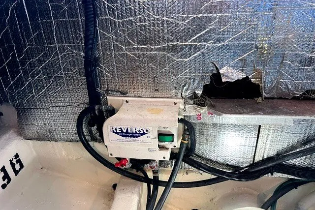 Slide: The Image of Engine compartment of a 2008 Back Cove 33 with Reverso oil change system. - 21
