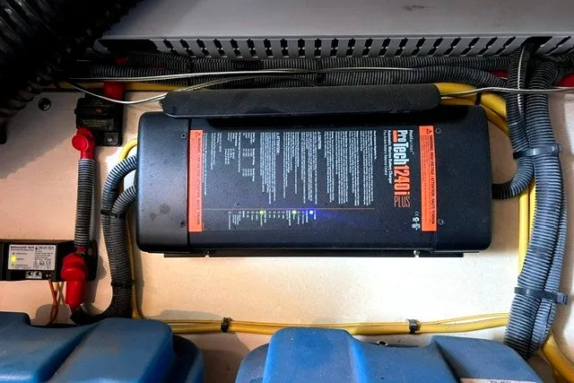 Slide: The Image of Battery charger setup in a 2008 Back Cove 33 boat engine compartment. - 20