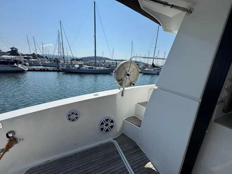 Slide: The Image of The 2016 Fountaine Pajot Motor Yacht 37 is docked, featuring a sleek deck design. - 4