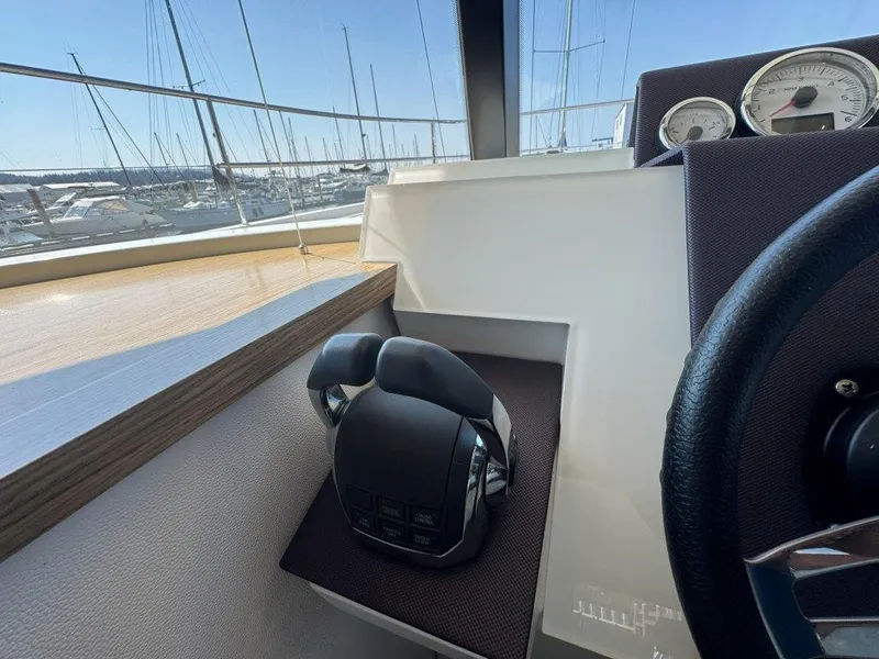Slide: The Image of The image shows the helm of a 2016 Fountaine Pajot Motor Yacht 37. - 18