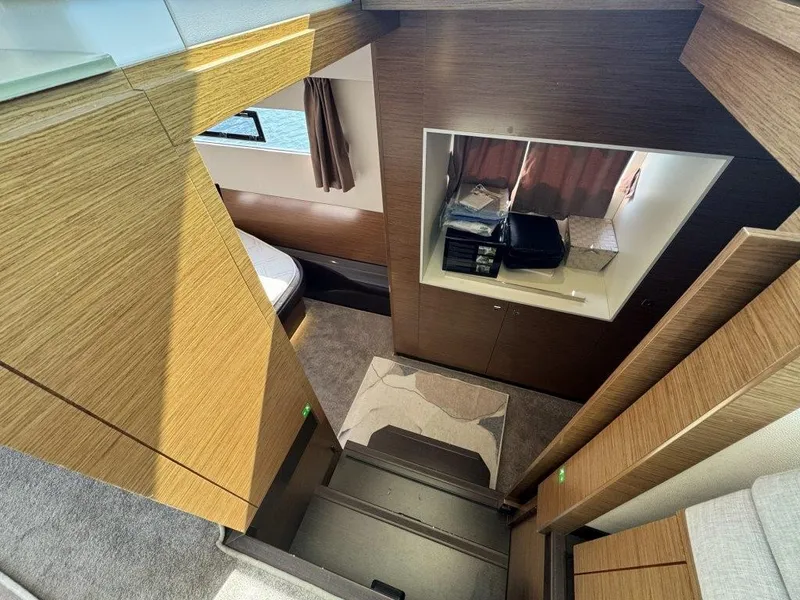 Slide: The Image of Interior of a 2016 Fountaine Pajot Motor Yacht 37 with wood paneling and stairs. - 22